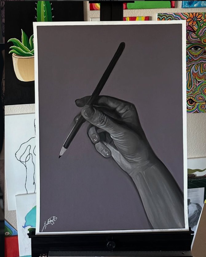 Hand with pencil drawing by Leland Lakata